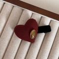 Close-up of heart-shaped burgundy fabric hair clip with a gold KOREA metal label - Gold Label Red - Heart Duckbill Clip