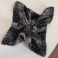 Detail of black and white paisley floral scrunchie folded into a butterfly shape - Black Paisley - Square Style