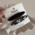 Detail of floral and solid black fabric BB hair clips on a handmade display card - Black Floral BB - Long Oval