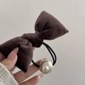 Detailed close-up of dark brown velvet bow hairpin with a polished silver bead detail - Bow Scrunchie / Brown