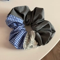 Detailed shot of grey fabric hair scrunchie with blue plaid pattern and lace embroidery - Gray Fabric Blue Plaid Scrunchie