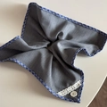 Detail of grey fabric scrunchie with blue checkered trim, lace, and white button - Gray Fabric Blue Plaid Square Scrunchie