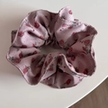 Detail view of pink rose pattern scrunchie with delicate polka dots and ruffled texture - Pink Rose