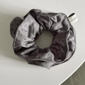 Detail of dark grey polka dot scrunchie with layered edges and woven fabric label - Gray Dots Double Layer