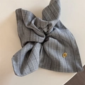 Macro detail of grey striped fabric scrunchie with gold round believe metal tag - Light Gray Square Scarf