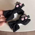 Detail of black bow hair clips with hollow floral embroidery and pink cherry accents - Black Cherry Bow Clip Pair