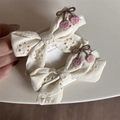 Detail of embroidered cherry lace bow hair clips with silver metal alligator clips - Off-white Cherry Bow Clip Pair