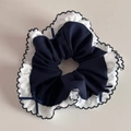 Detail of blue and white ruffled scrunchie with navy ribbon bows and wavy edges - Navy Petal Style (FQ881417)