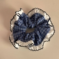 Detail of blue plaid scrunchie with white ruffled edges and black wave stitching - Blue Plaid Petal Style (FQ881417)
