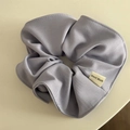 Close-up of lilac sponge headband with twill fabric texture and Hand Made label - Candy Series Hair Tie - Light Purple