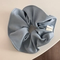 Detailed texture of blue cotton scrunchie with a white Hand Made textile label - Candy Series Hair Tie - Light Blue