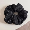 Macro detail of large floral scrunchie showing black and white wavy pleated fabric texture - Large / Black With White Flowers