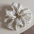 Detail showing the floral crinkled texture of this large cream and black scrunchie - Large / Off-White Black Floral