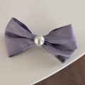 Detailed macro view of a purple lace bow hair tie with a pearl center and handmade metal tag - Dreamy Purple - Pearl Bow Clip