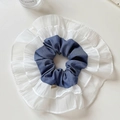 Detail of denim blue cotton and white layered chiffon ruffle scrunchie with soft texture - Blue