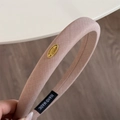 Elegant wide fabric headband in dusty pink color featuring a golden metal logo plate - 2 cm / Pink