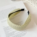 Detailed view of candy color polka dot headband with pleated fabric texture and non-slip teeth - Green Polka Dot