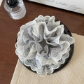 Detailed view of grey polka dot lace scrunchie with intricate white scalloped edges - Gray