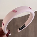Pink padded headband with small bow accents and handmade label for elegant hairstyling - Dreamy Pink - Headband