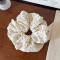 Detail of white scrunchie with black heart pattern and Hand Made woven label - Scrunchie