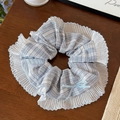 Detail view of blue checkered scrunchie with pleated edges and a light blue ribbon bow - Blue Striped Hair Tie