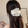 Lace pearl bow hair clip on model with long wavy hair for an elegant French style - Binder Clip