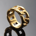 Macro detail of a golden hollow chain ring with polished stainless steel finish - US 7 / Gold
