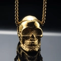 Macro shot of polished gold skull pendant with detailed facial features and bead chain - Pendant Only (No Chain) / Gold