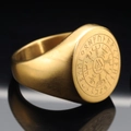 Golden Viking ring with Valknut symbol and runic compass on a black reflective surface - US 7 / Gold