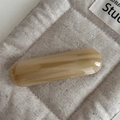 Close-up of amber marble acetate hair clip featuring France Handmade engraving detail - Milk Apricot
