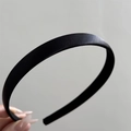 Detailed view of the smooth black satin texture and finish on this French retro headband - Slim Thin Style / Black