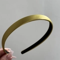 Close-up of mustard yellow satin headband with a black non-slip inner lining - Slim Thin Style / Turmeric
