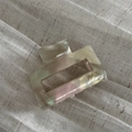 Detail showing marble textured acetate hair claw with France handmade engraving - Shell White