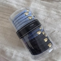 Detail of blue velvet hair scrunchies with gold metal beads in a transparent case - Canister Flocked-Blue Black