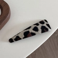 Close-up of leopard print triangular hair clip showing retro velvet texture and pattern - Beige Leopard-Triangle