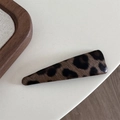 Close-up of leopard print leather hair clip with a classic triangle water drop shape design - Coffee Leopard-Triangle