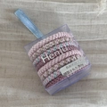 Detail of woven high-elastic hair ties in soft pastel tones inside a gift box - Pink