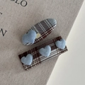 Detail of two-piece British blue plaid fabric hair clips with 3D heart embellishments - Blue Plaid Light Blue Hair Clip Pair