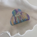 Macro detail of gradient acetate shell hair claw clip with cutout design and spring - Iridescent Blue Purple