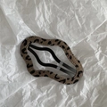 Detail of leopard print wavy snap hair clip with black metal spring clip mechanism - Coffee Leopard Cloud