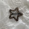Close-up of star-shaped hair clip with leopard print fabric and black BB metal clip - Coffee Leopard Star