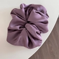 Detailed close-up of glossy purple satin oversized scrunchie with elegant folds - Dust Rose