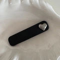 Close-up of black leather rectangular hair clip with a silver metal heart detail - Black Rectangle