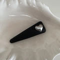 Macro detail of black leather triangular hair clip with silver metallic heart - Black Triangle