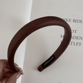 Close-up of brown leather headband showing handmade label and premium thick padding details - Light Coffee (Soft Leather Headband)