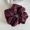Detailed view of large burgundy scrunchie with pleated texture and storage bag - Wine Red