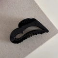 Close-up of elegant black acetate hair claw with golden Barrette la France lettering - Black
