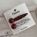 Close-up of red and white polka dot hair clips with smooth round bead detail on a card - Red White Polka Dot - Straight