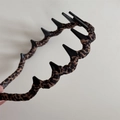 Detail of leopard print fabric headband featuring a black plastic wide-toothed inner grip - Leopard Wrapped Headband