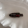 Detail shot of a sweet plaid hair clip with cherry decoration on a textured white tray - Cherry Decoration Plaid Style / Coffee